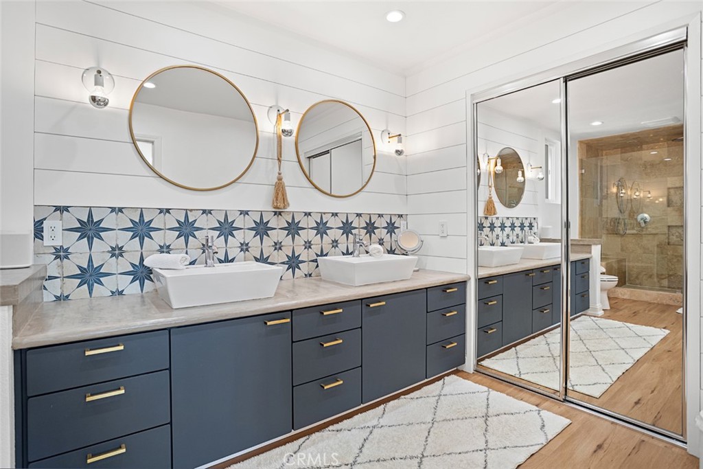 5555 Fairview Place Agoura Hills, CA 91301 - Photo 16 of 39 a bathroom with a double vanity sink mirror and bathtub