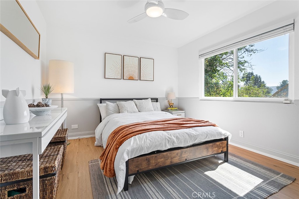 5555 Fairview Place Agoura Hills, CA 91301 - Photo 19 of 39 a bedroom with bed and window