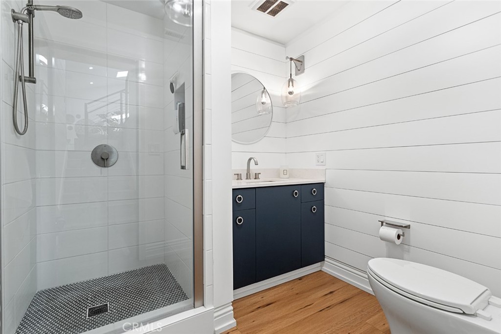 5555 Fairview Place Agoura Hills, CA 91301 - Photo 24 of 39 a bathroom with a toilet a sink and shower