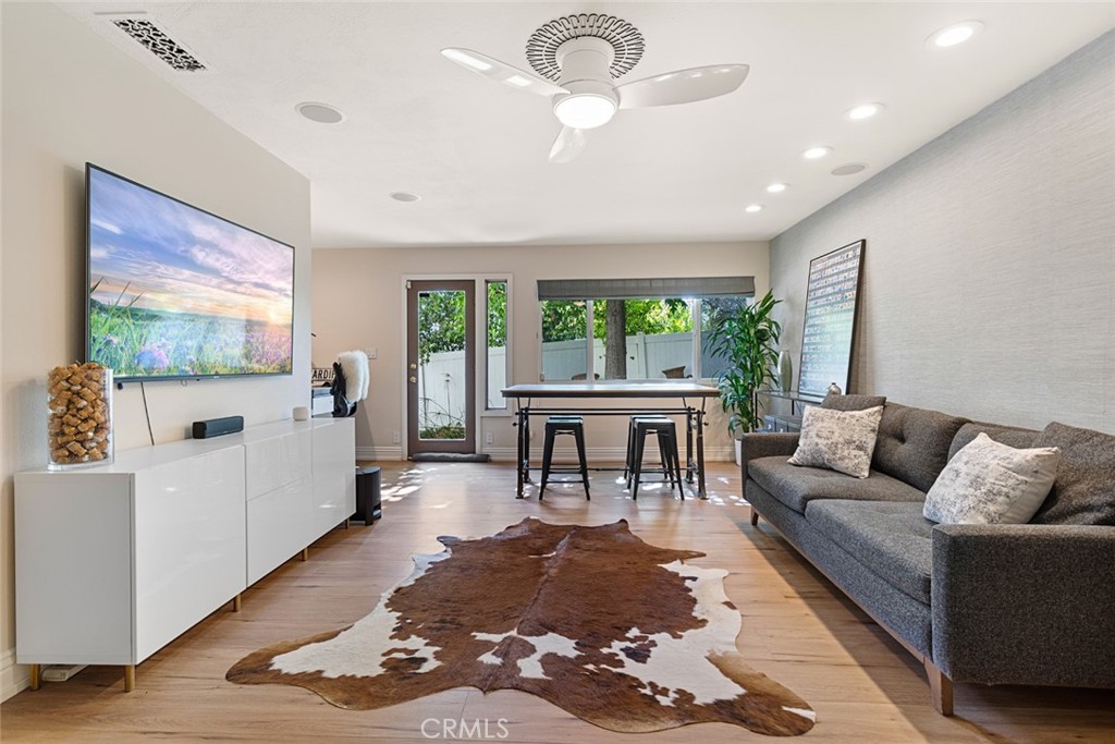 5555 Fairview Place Agoura Hills, CA 91301 - Photo 26 of 39 a living room with furniture and a flat screen tv