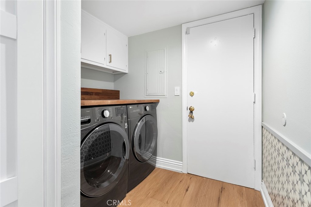 5555 Fairview Place Agoura Hills, CA 91301 - Photo 27 of 39 a utility room with washing machine