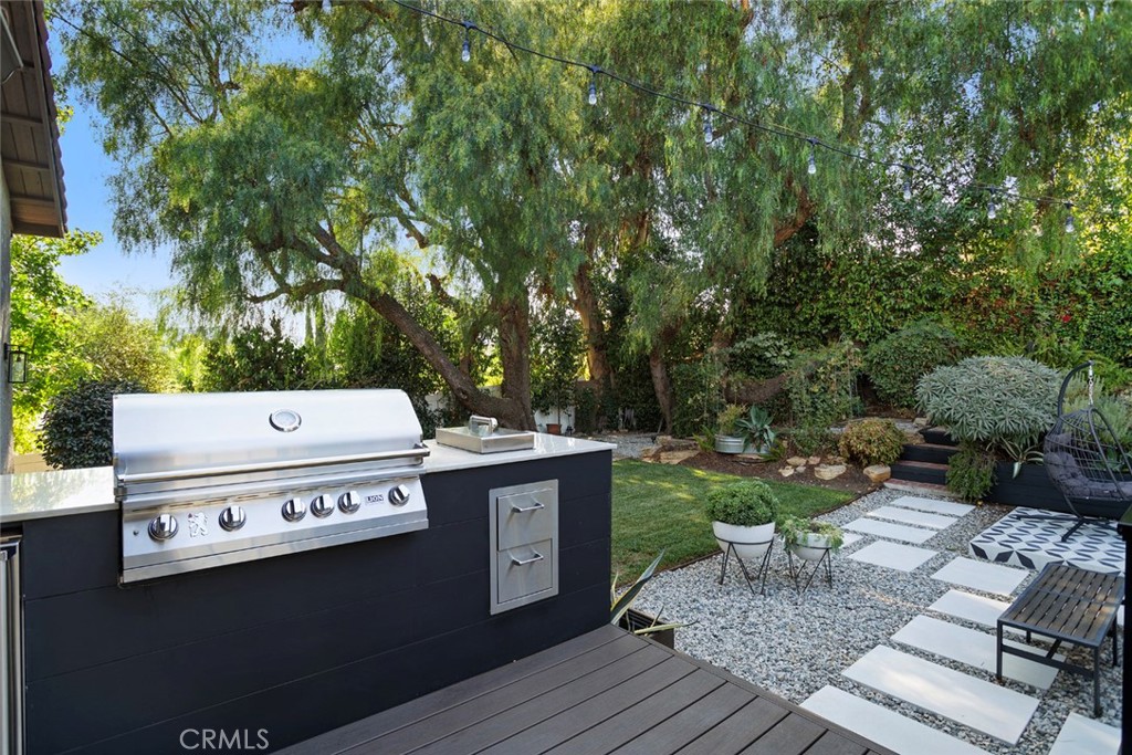 5555 Fairview Place Agoura Hills, CA 91301 - Photo 28 of 39 a view of a chairs and table on the wooden floor