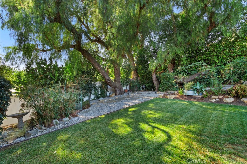 5555 Fairview Place Agoura Hills, CA 91301 - Photo 32 of 39 a view of a backyard with large trees