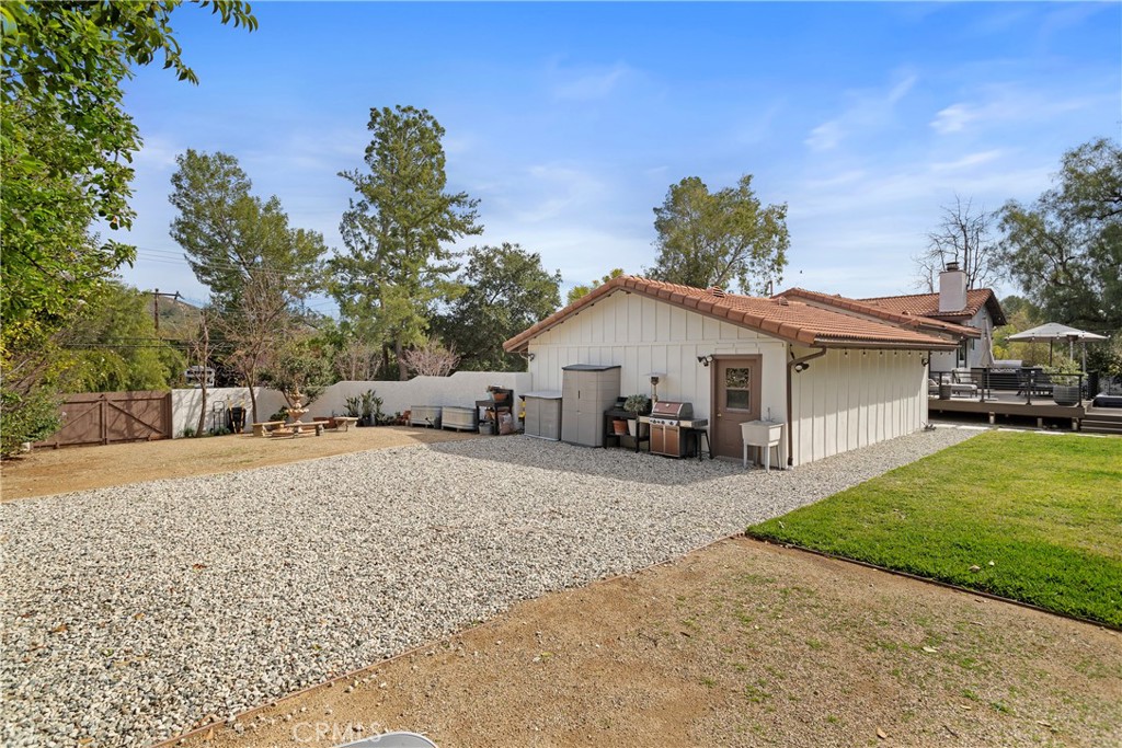 5555 Fairview Place Agoura Hills, CA 91301 - Photo 33 of 39 a front view of a house with a yard and garage