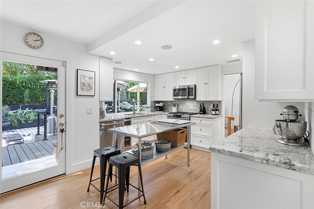 5555 Fairview Place Agoura Hills, CA 91301 - Photo 9 of 39 a kitchen with counter top space cabinets and appliances