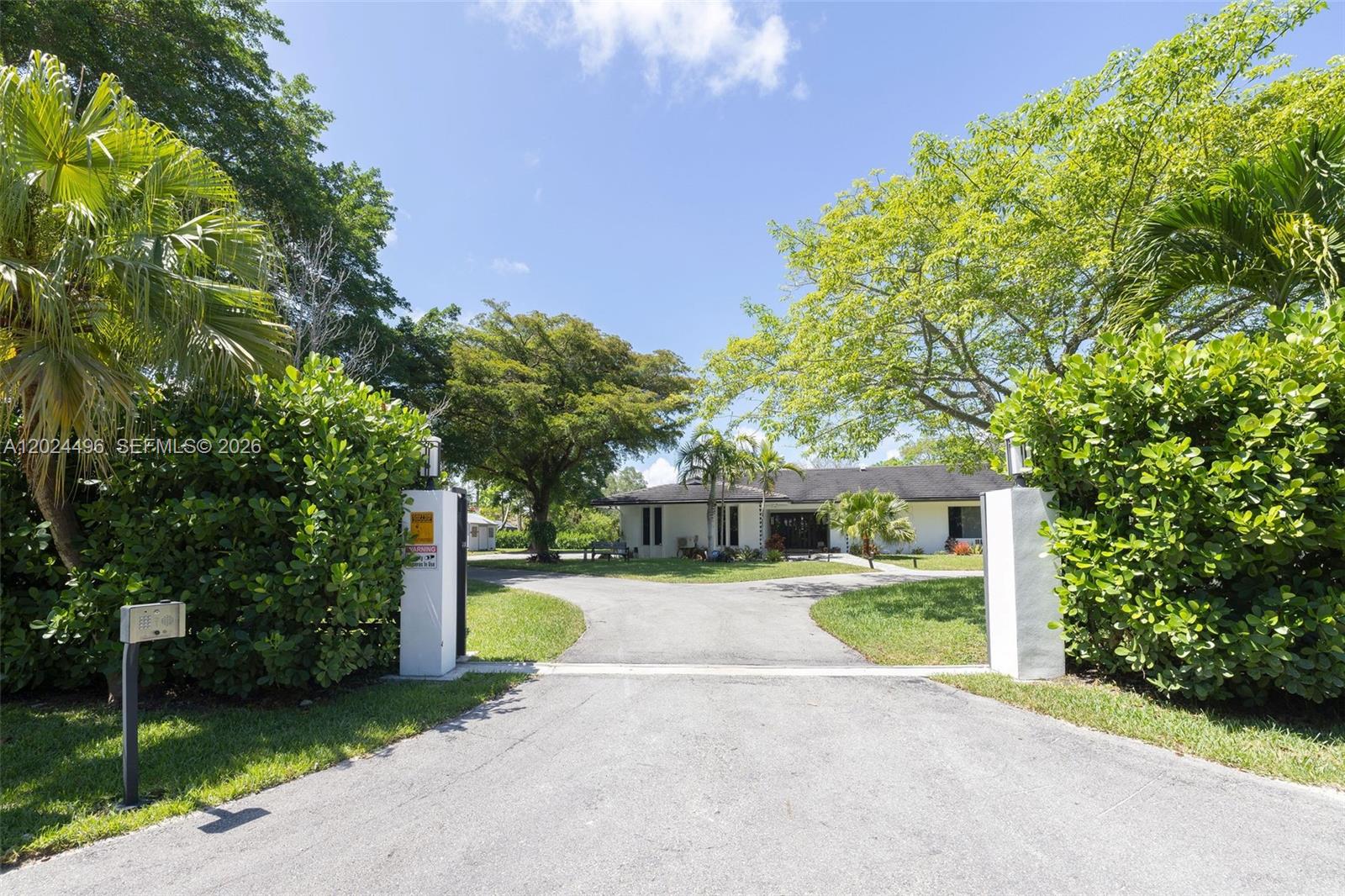 6875 North Cartee Road Palmetto Bay, FL 33158 - Photo 2 of 42 a view of a house with a backyard