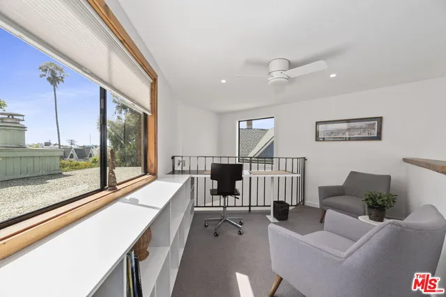 a very nice looking living room with a large window