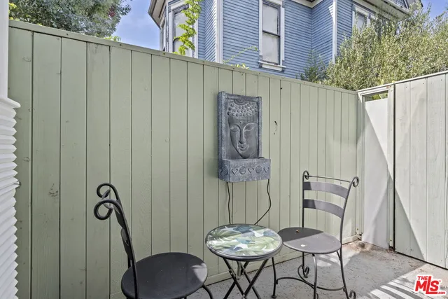 a view of a balcony furniture and a potted plant