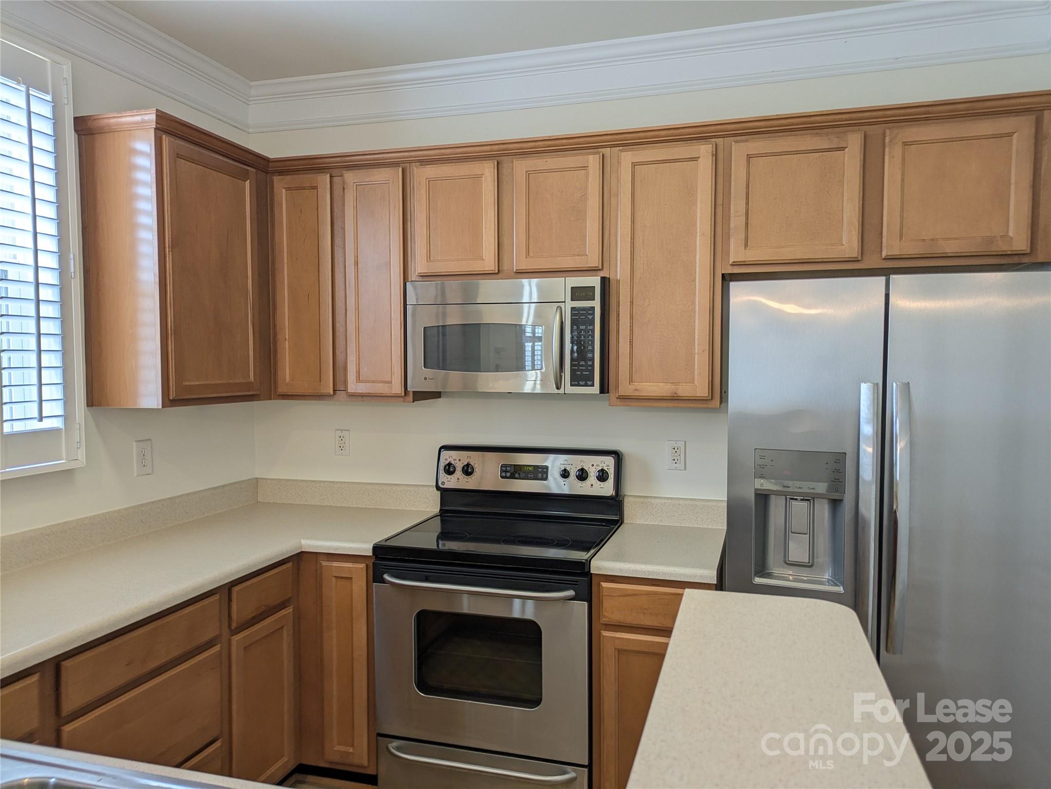 103 Chawton Lane Mooresville, NC 28117 - Photo 11 of 31 a kitchen with stainless steel appliances granite countertop a refrigerator stove and sink
