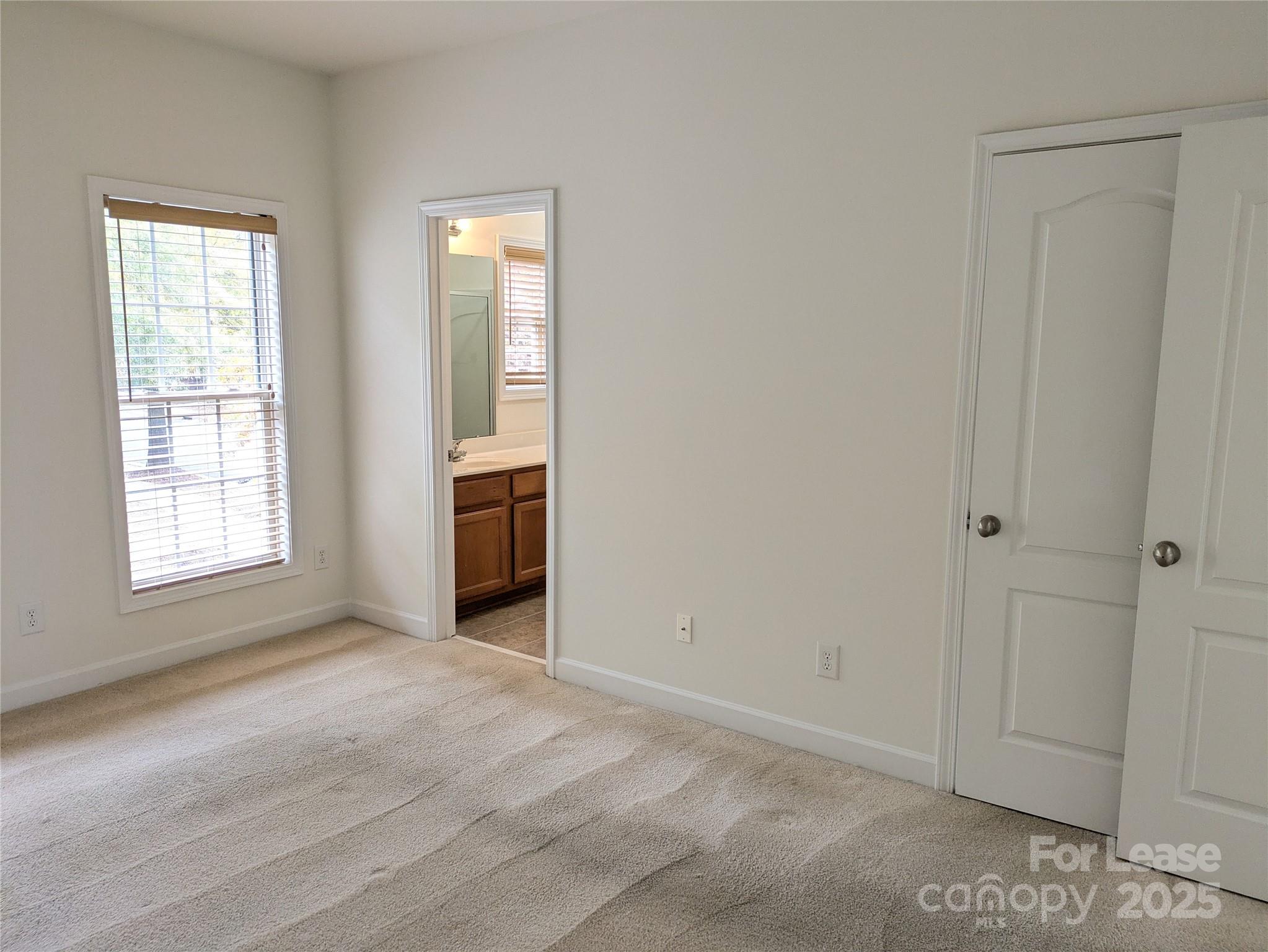103 Chawton Lane Mooresville, NC 28117 - Photo 21 of 31 an empty room with windows and closet