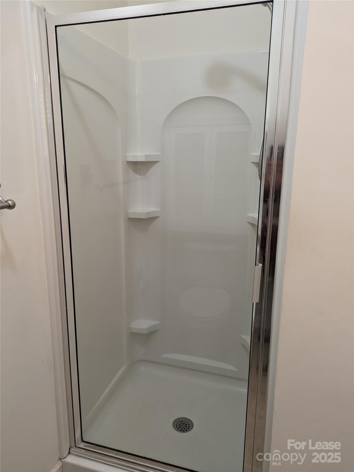 103 Chawton Lane Mooresville, NC 28117 - Photo 25 of 31 a bathroom with a glass shower door