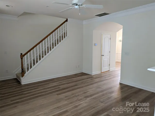 a view of an entryway with wooden floor