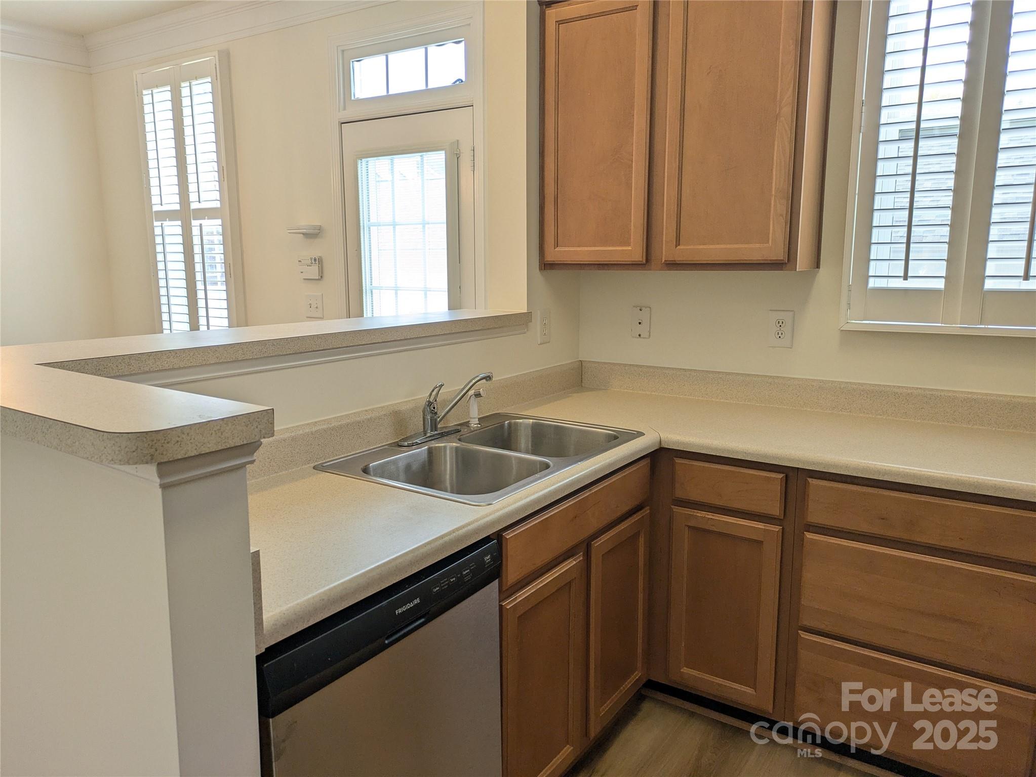 103 Chawton Lane Mooresville, NC 28117 - Photo 10 of 31 a kitchen with a sink cabinets and window
