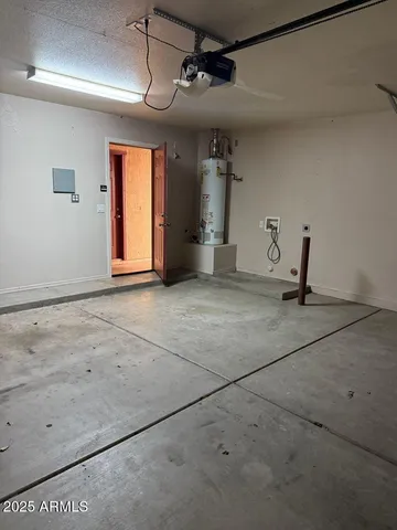 a view of a livingroom with a ceiling fan and window