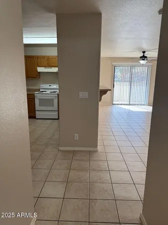 a view of a kitchen with a sink and a stove top oven