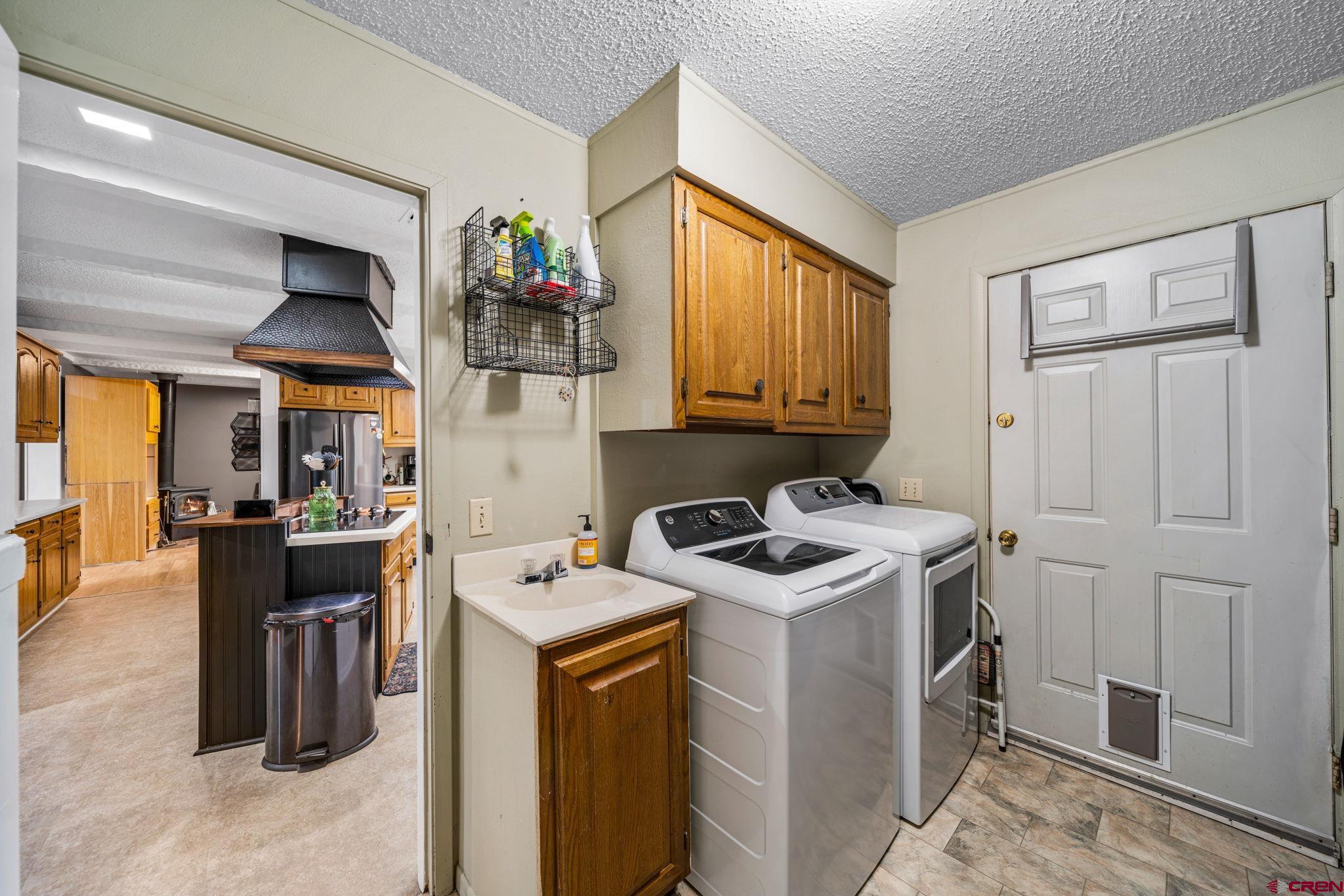 199 Timber Drive Durango, CO 81303 - Photo 12 of 29 a view of a kitchen with fridge and workspace