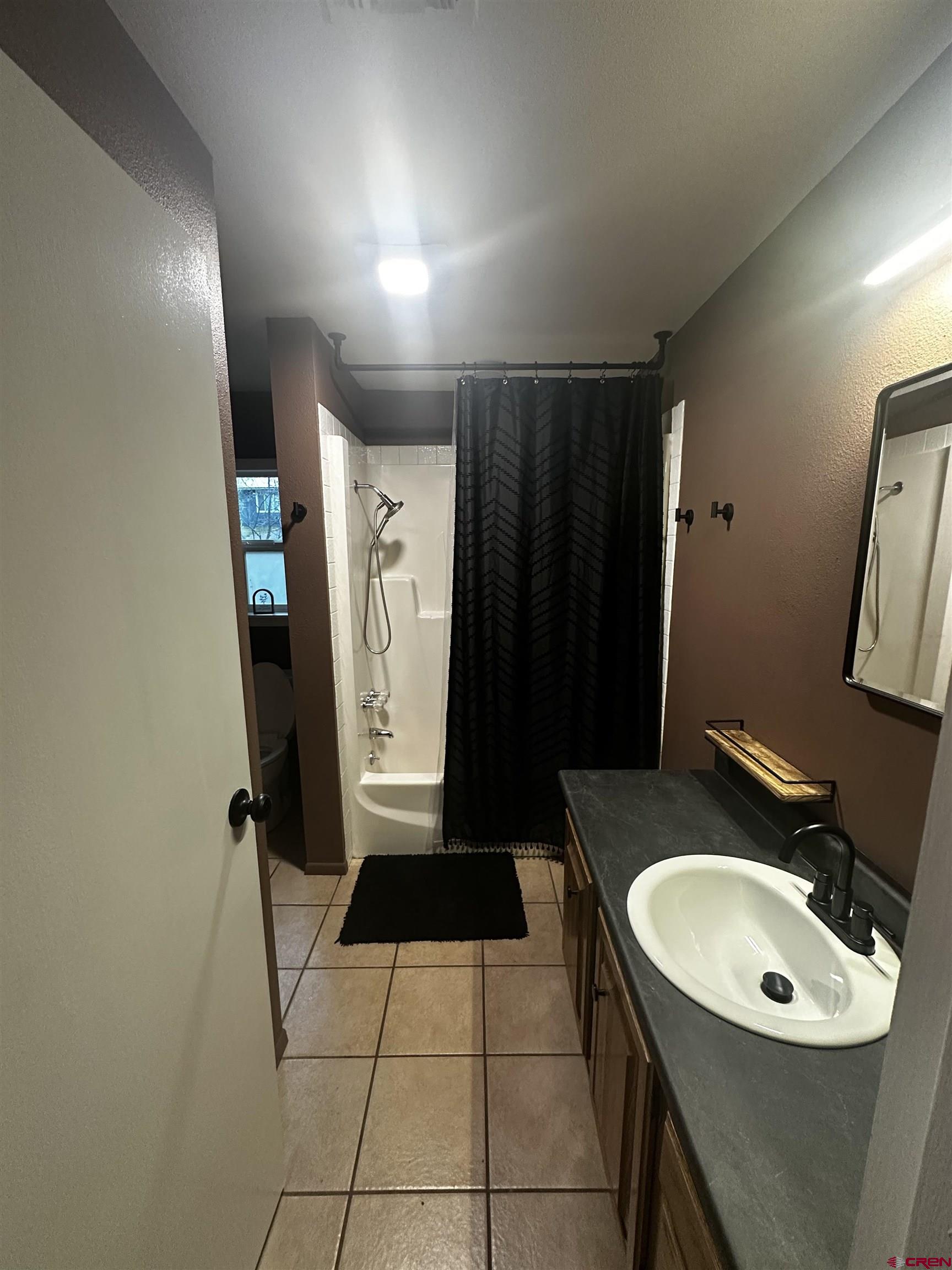 199 Timber Drive Durango, CO 81303 - Photo 19 of 29 a bathroom with a sink toilet and shower