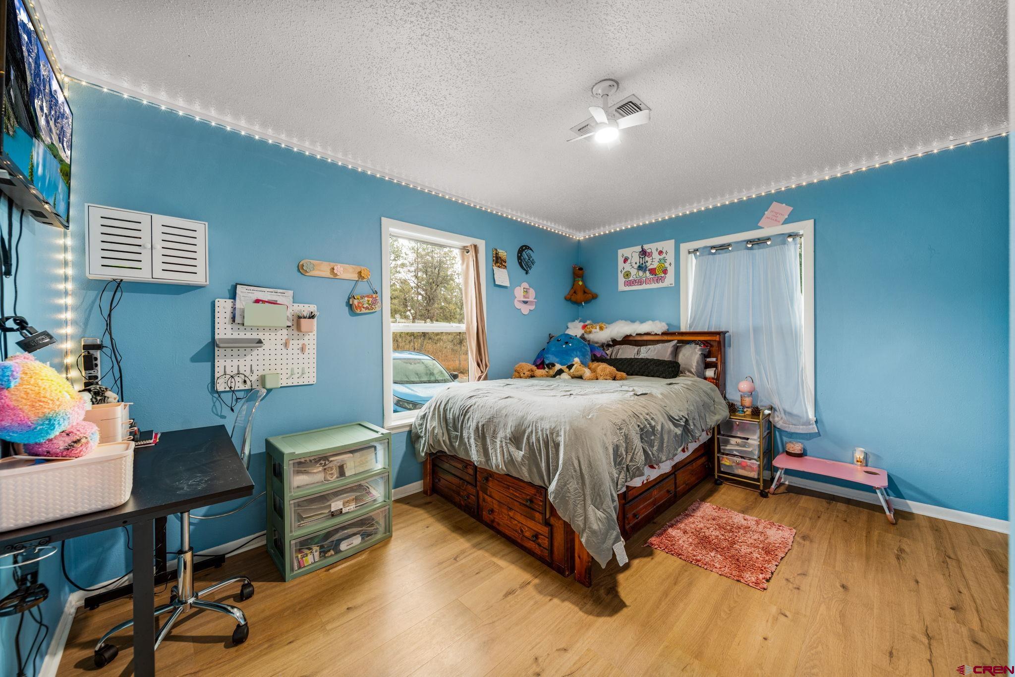 199 Timber Drive Durango, CO 81303 - Photo 22 of 29 a bedroom with a bed and a desk
