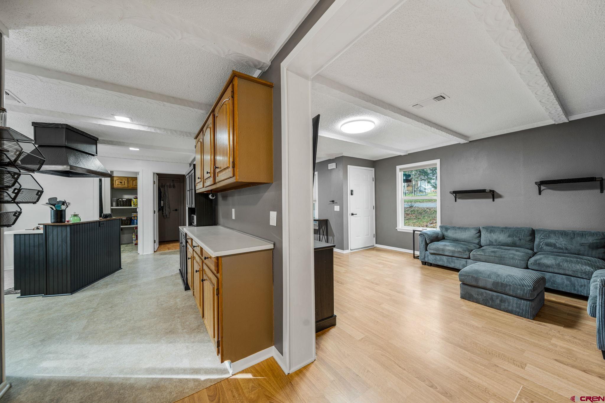 199 Timber Drive Durango, CO 81303 - Photo 25 of 29 a living room with furniture and a wooden floor