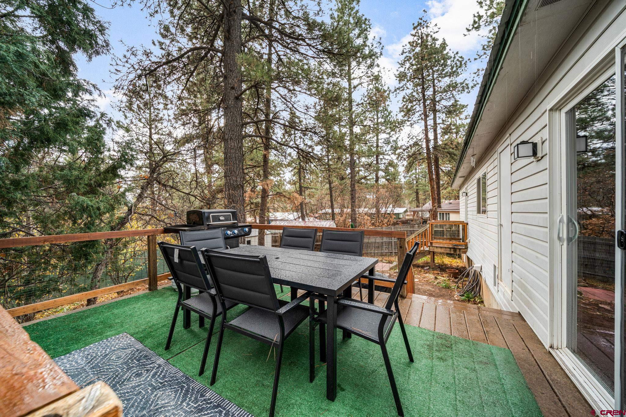 199 Timber Drive Durango, CO 81303 - Photo 26 of 29 a view of a backyard with table and chairs