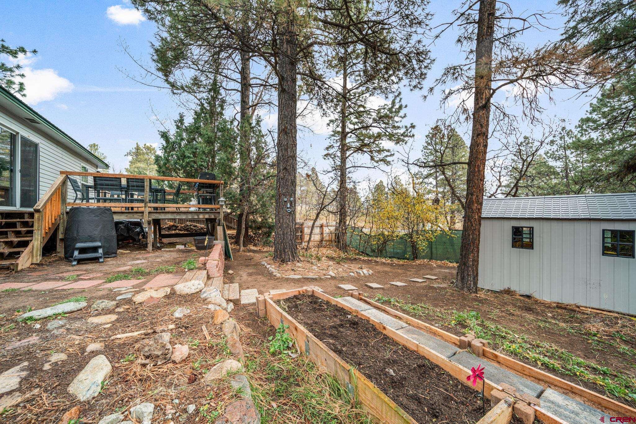 199 Timber Drive Durango, CO 81303 - Photo 27 of 29 a view of a backyard with wooden fence