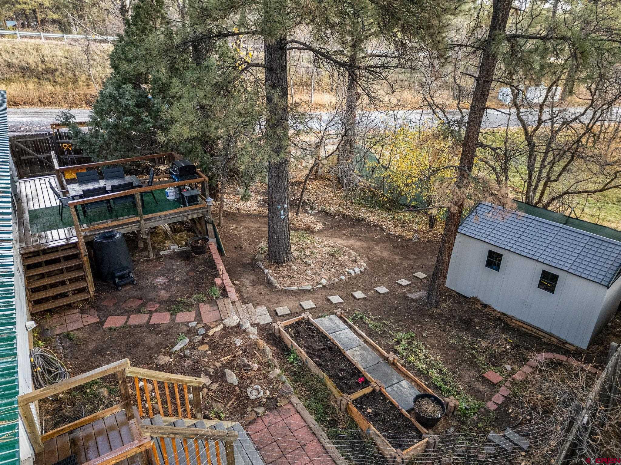 199 Timber Drive Durango, CO 81303 - Photo 5 of 29 a backyard of a house with outdoor seating