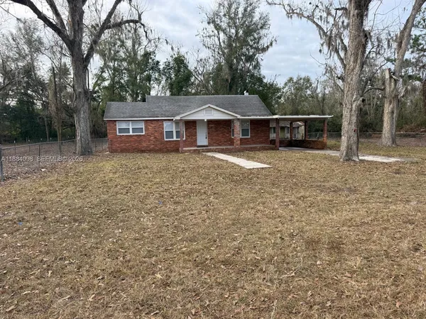 a front view of a house with yard