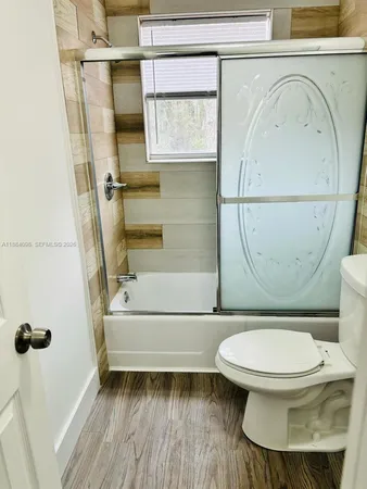 a bathroom with a toilet and a sink