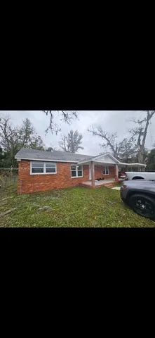 a view of a big house with a big yard