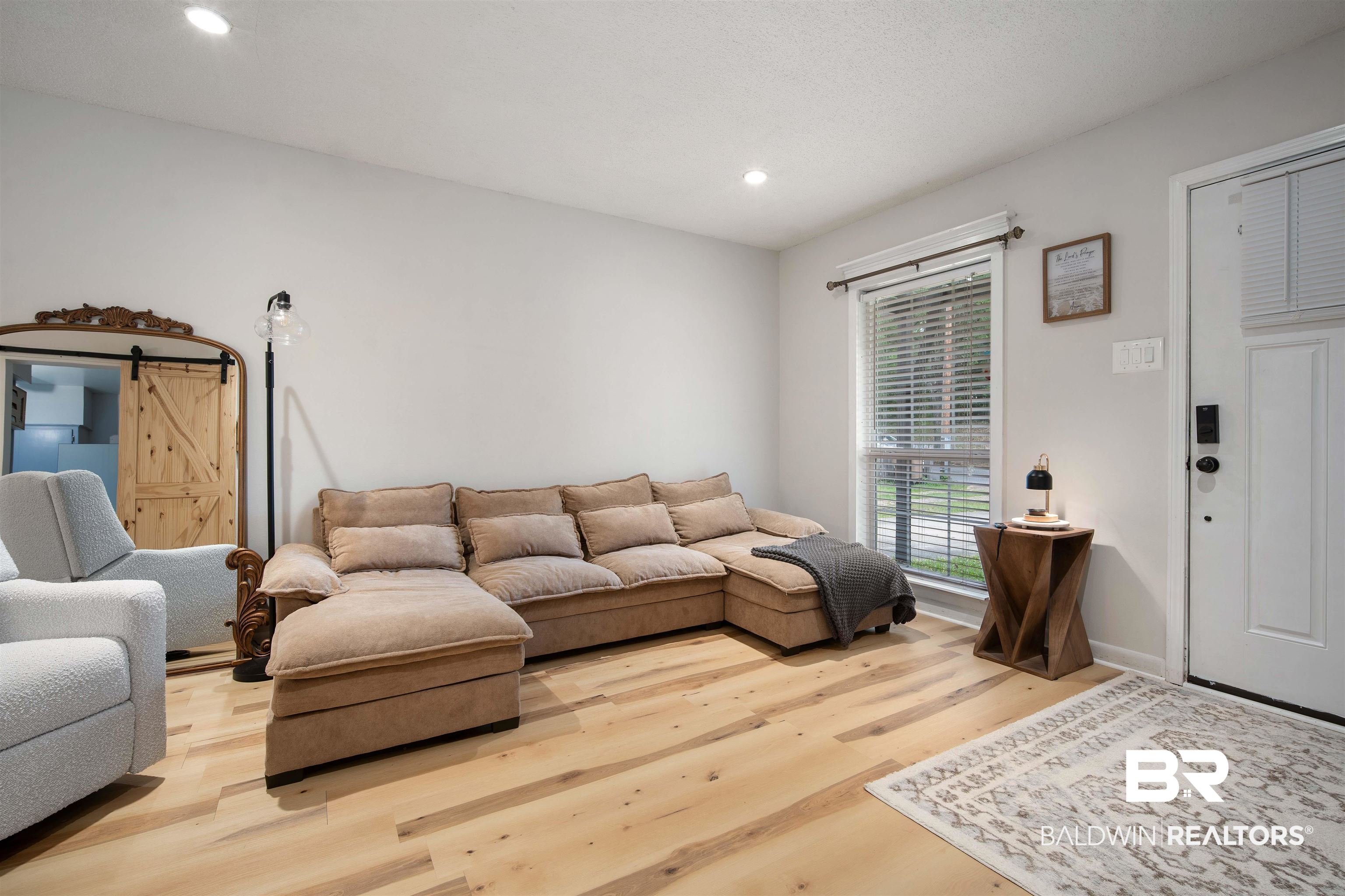 1451 West Morlee Drive Mobile, AL 36618 - Photo 5 of 30 Living room featuring a barn door, LVP floors, and recessed lighting