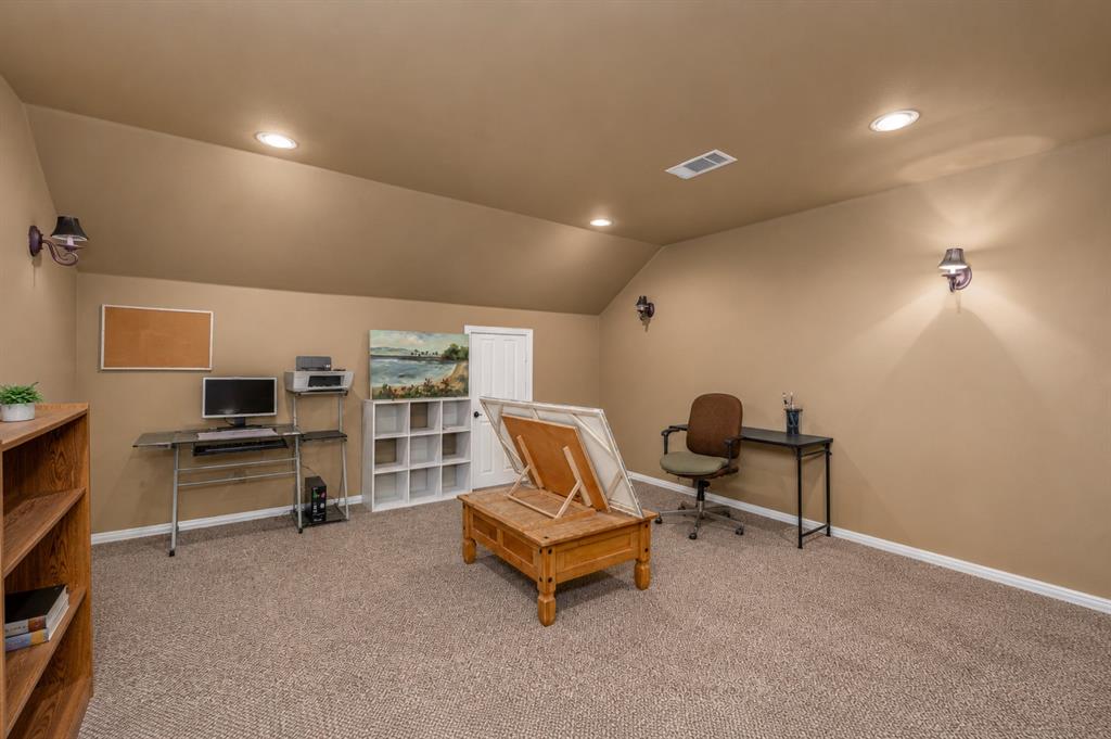100 Manders Court Runaway Bay, TX 76426 - Photo 24 of 33 a living room with furniture and a flat screen tv