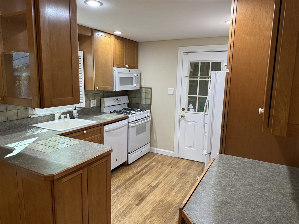 5 Westview Road Worcester, MA 01602 - Photo 8 of 20 a kitchen with a sink stove and cabinets