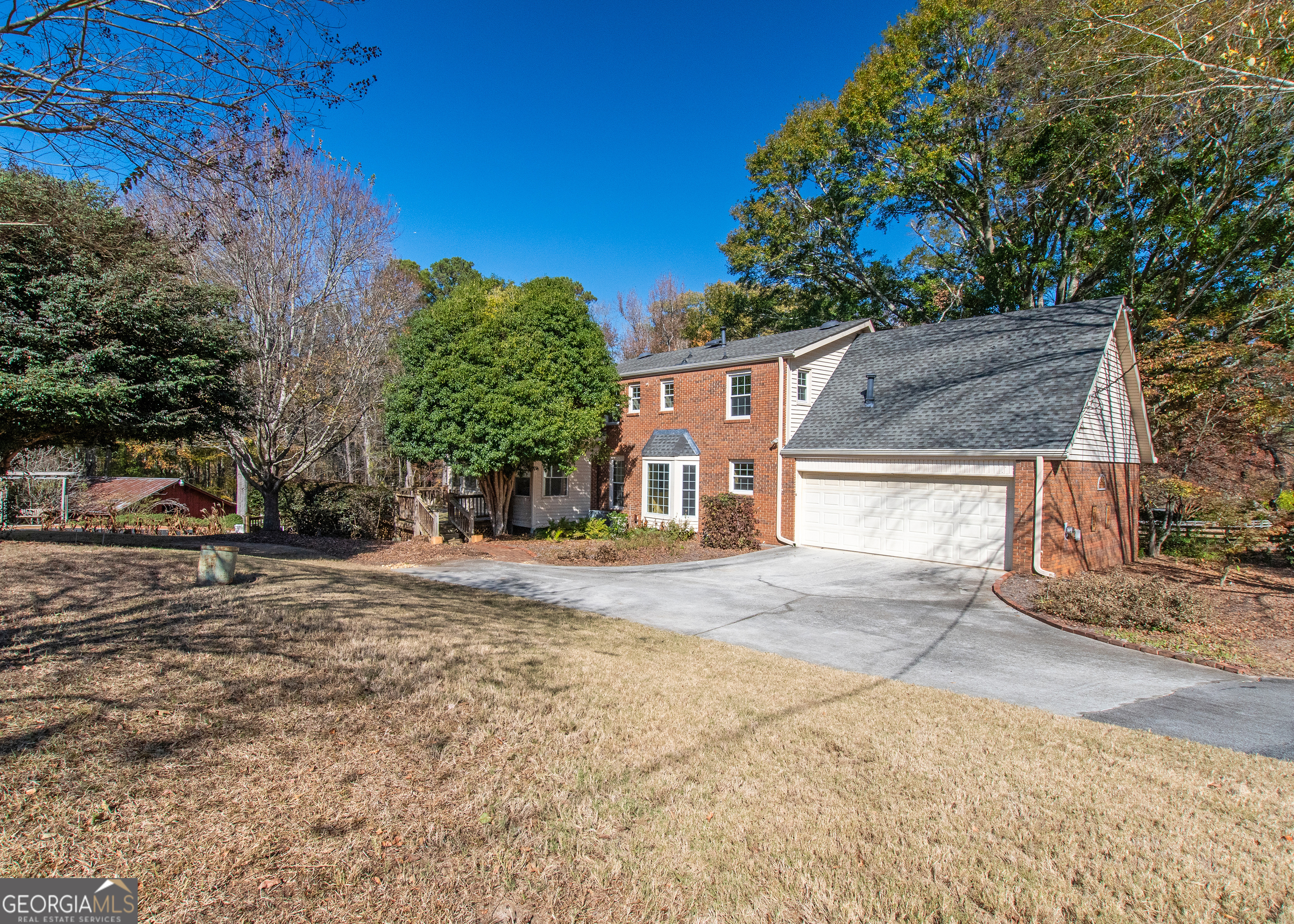 13819 Woolsey Road Hampton, GA 30228 - Photo 52 of 100 a front view of a house with a yard and garage