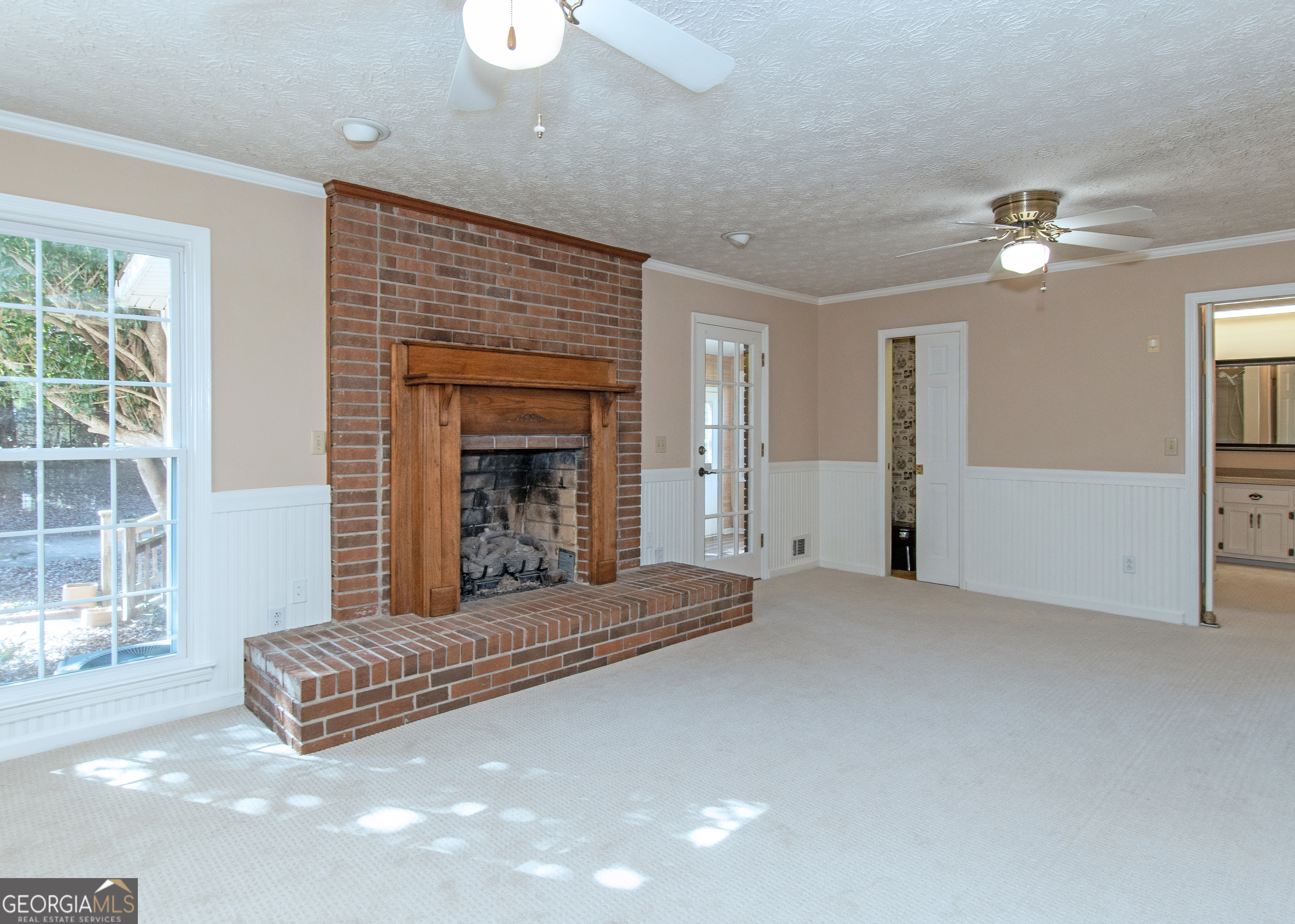 13819 Woolsey Road Hampton, GA 30228 - Photo 67 of 100 a living room with furniture and a fireplace