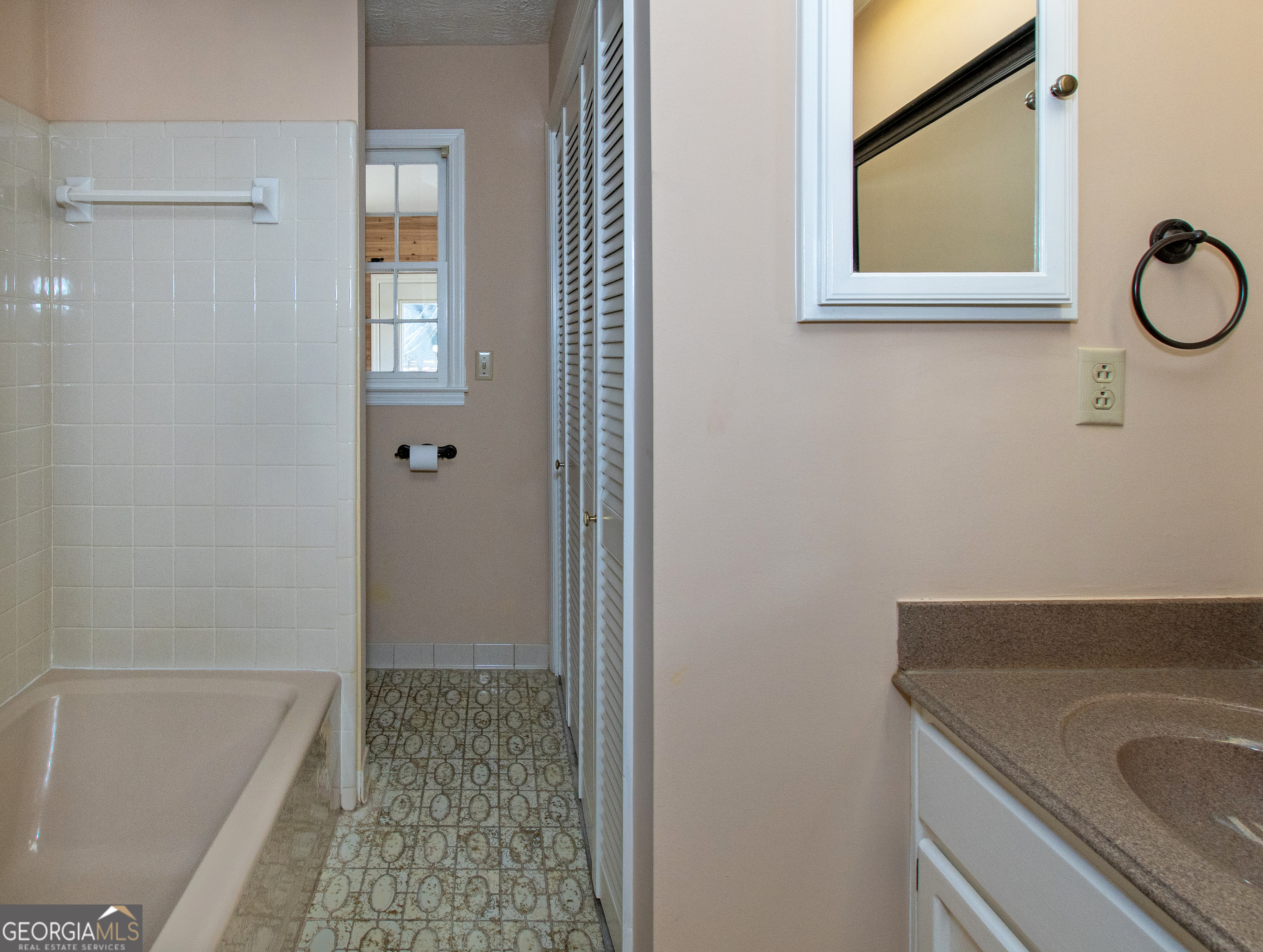 13819 Woolsey Road Hampton, GA 30228 - Photo 73 of 100 a bathroom with a granite countertop sink and a mirror