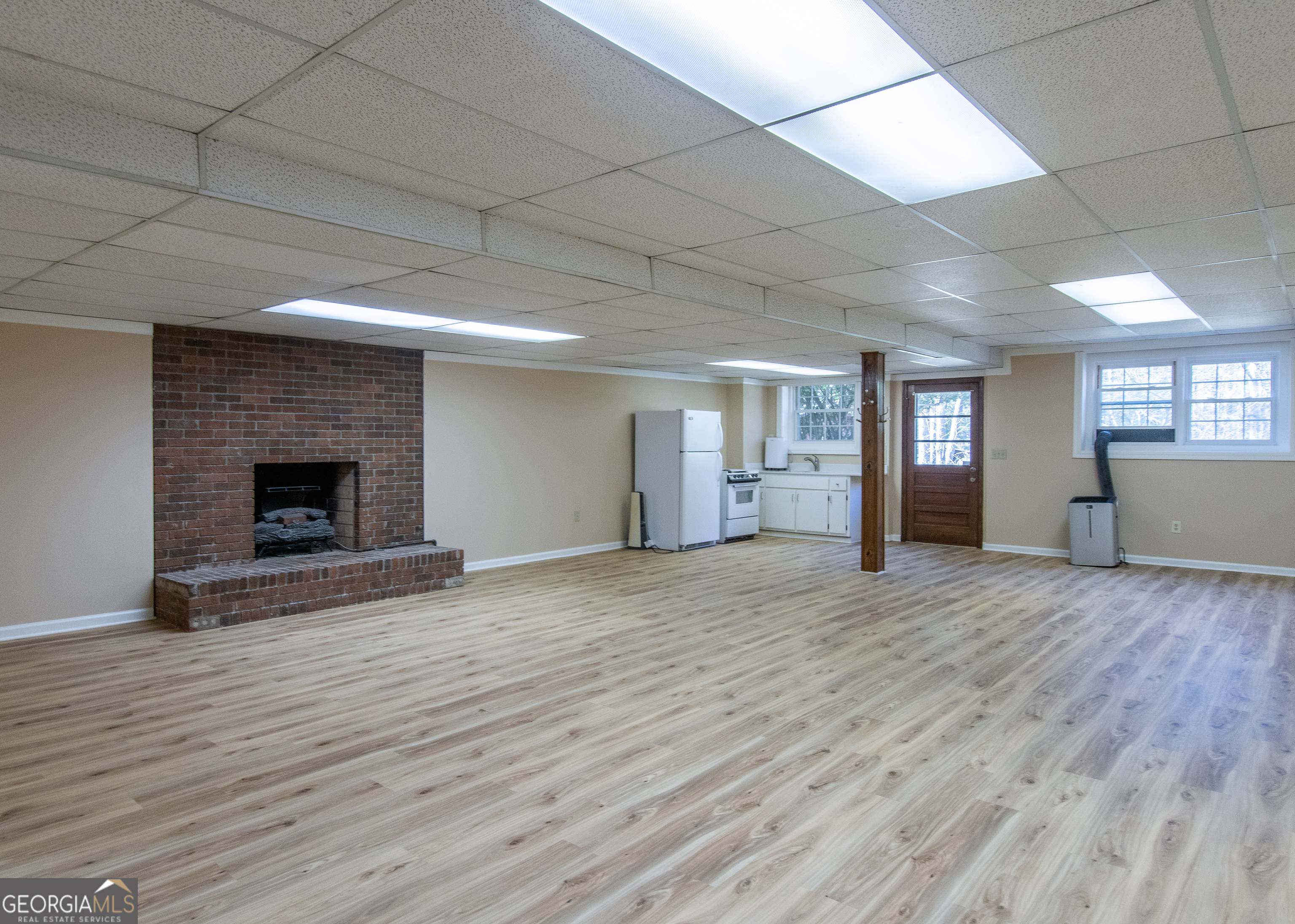 13819 Woolsey Road Hampton, GA 30228 - Photo 86 of 100 a view of empty room with wooden floor and fireplace