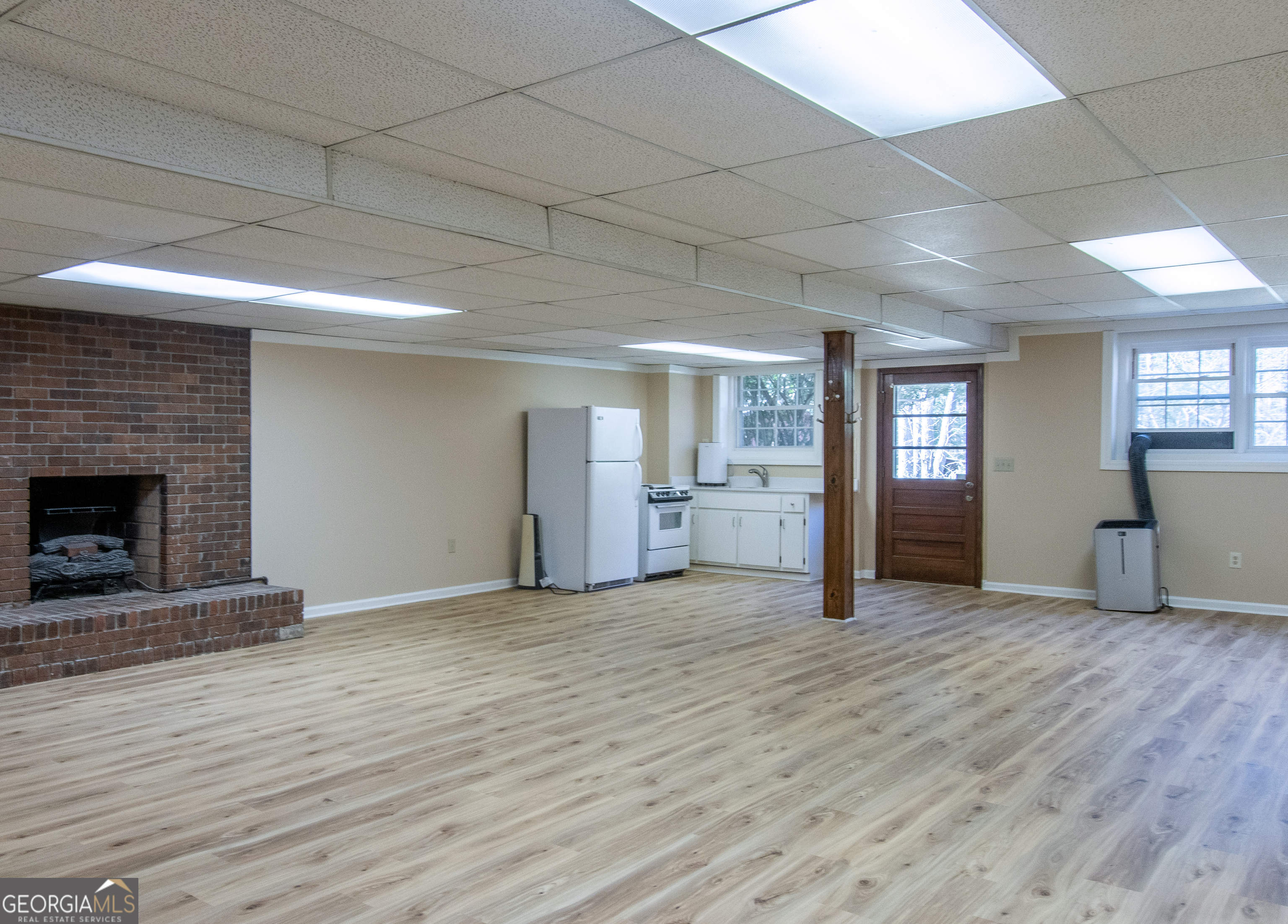 13819 Woolsey Road Hampton, GA 30228 - Photo 87 of 100 a view of empty room with wooden floor and fireplace