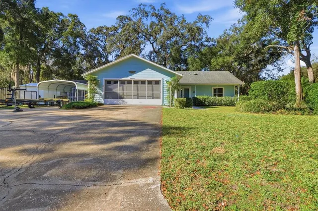 a bathroom with a shower sink and mirror