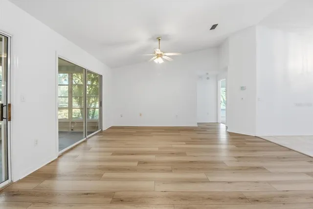 an aerial view of a house with a yard and garden