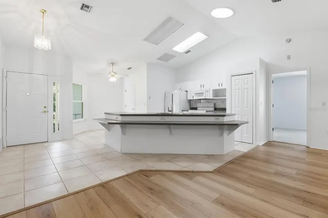 an aerial view of residential house with outdoor space and trees