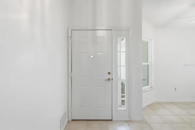 a view of a house with a backyard and a window