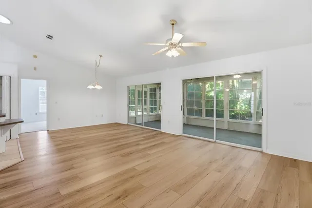 a view of a backyard with table and chairs