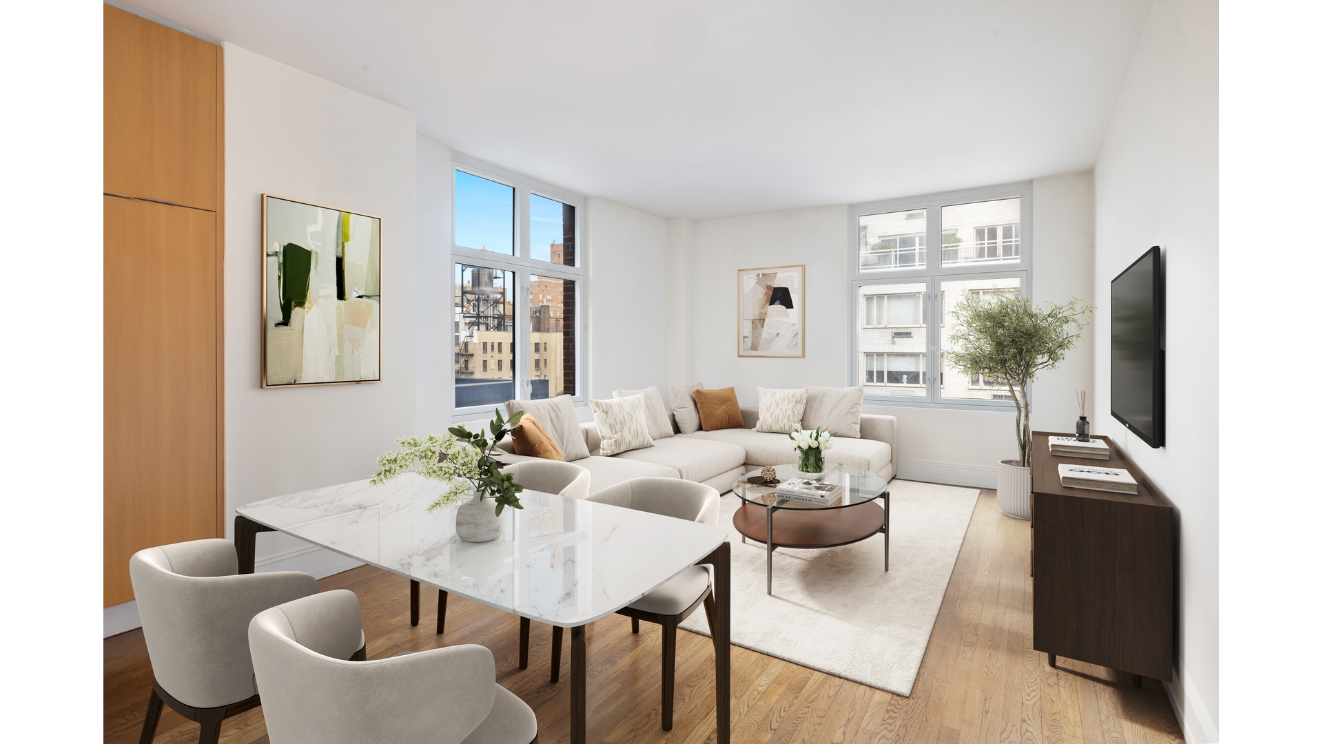 a living room with furniture a large window and a wooden floor