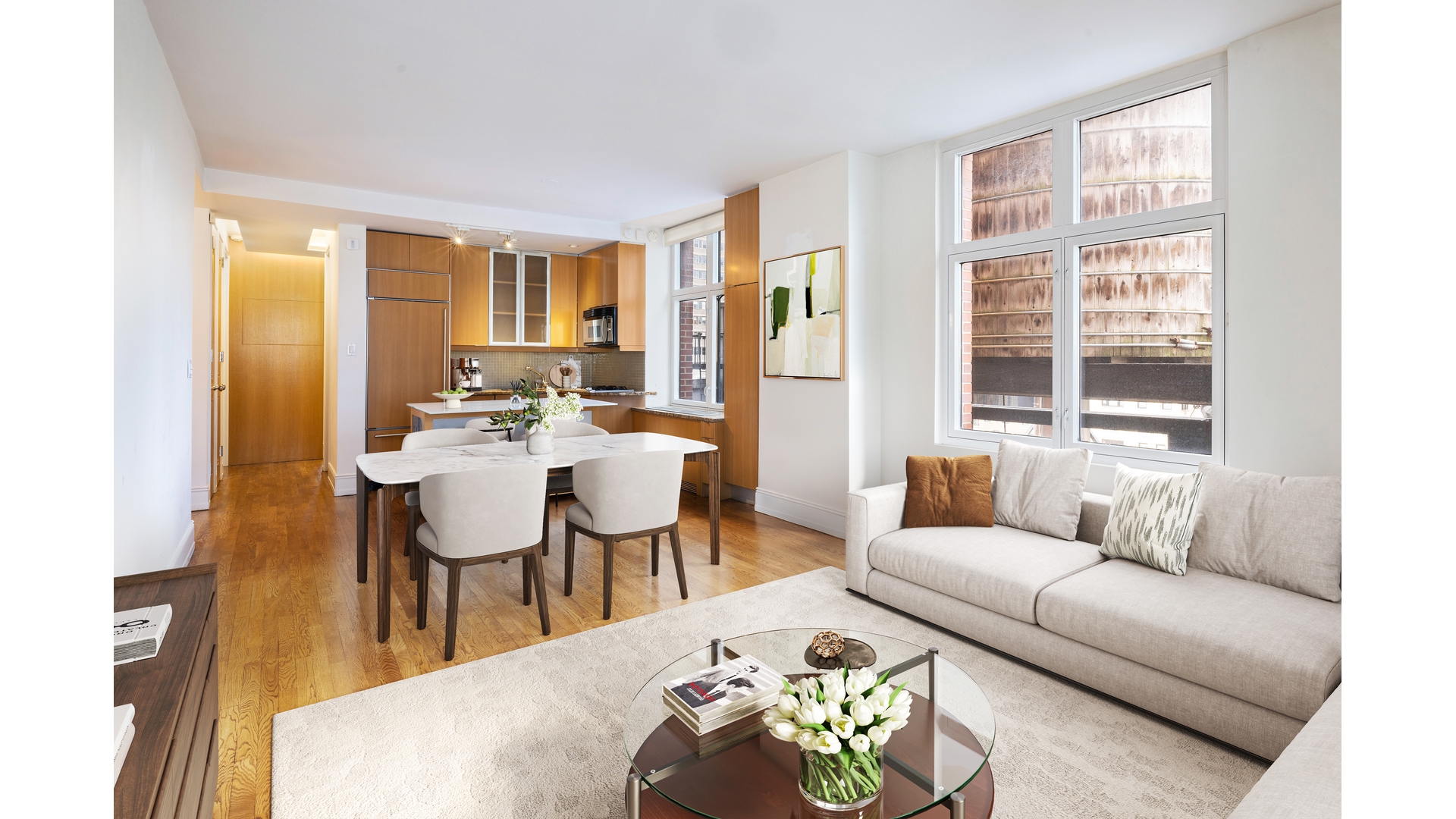 188 East 70th Street, Unit 11D Manhattan, NY 10021 - Photo 4 of 14 a living room with furniture and a large window