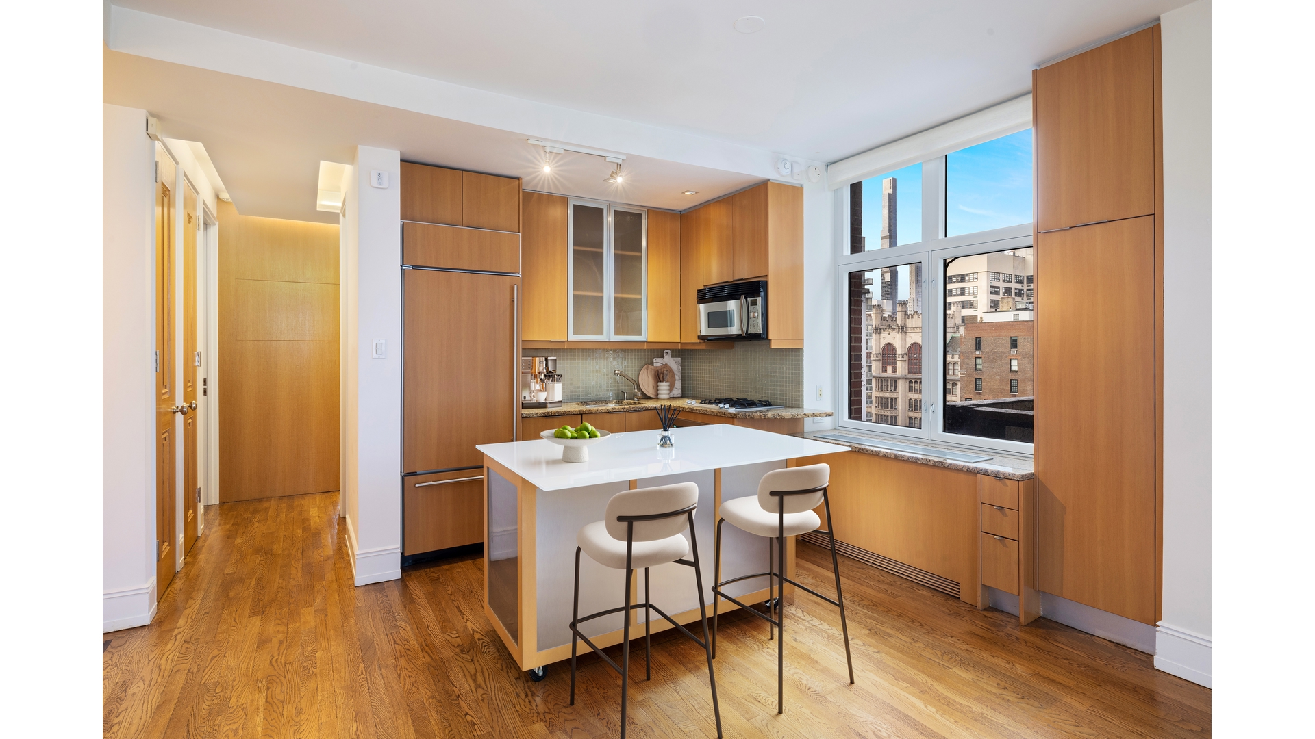 188 East 70th Street, Unit 11D Manhattan, NY 10021 - Photo 6 of 14 a kitchen with a sink stove and wooden floor