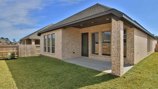 a view of house with backyard