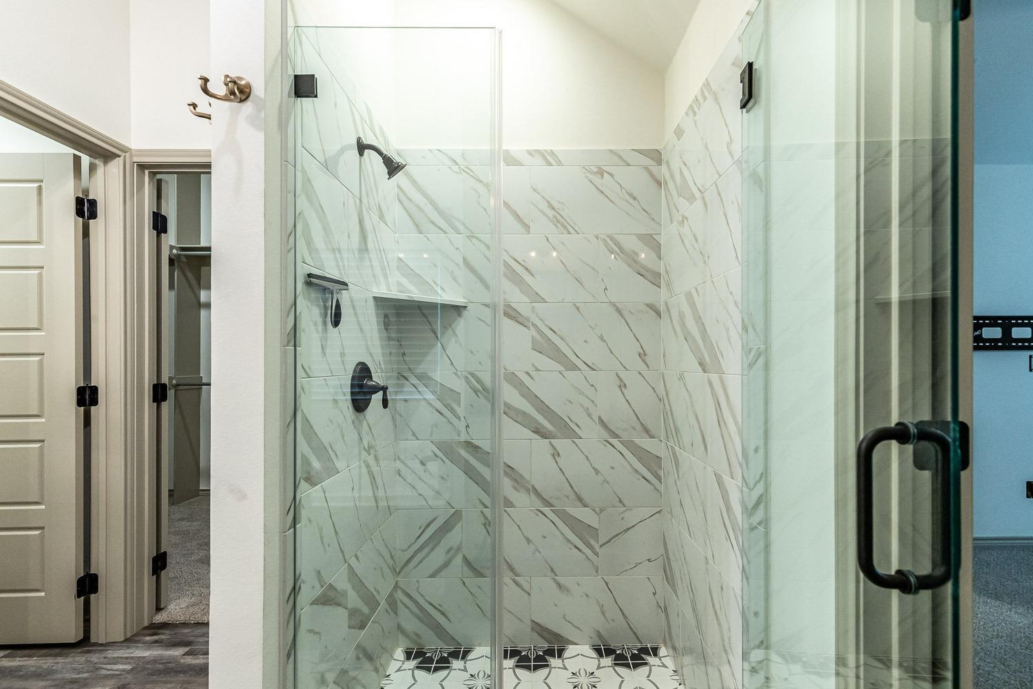 3633 133rd Street Lubbock, TX 79423 - Photo 23 of 46 a bathroom with a shower