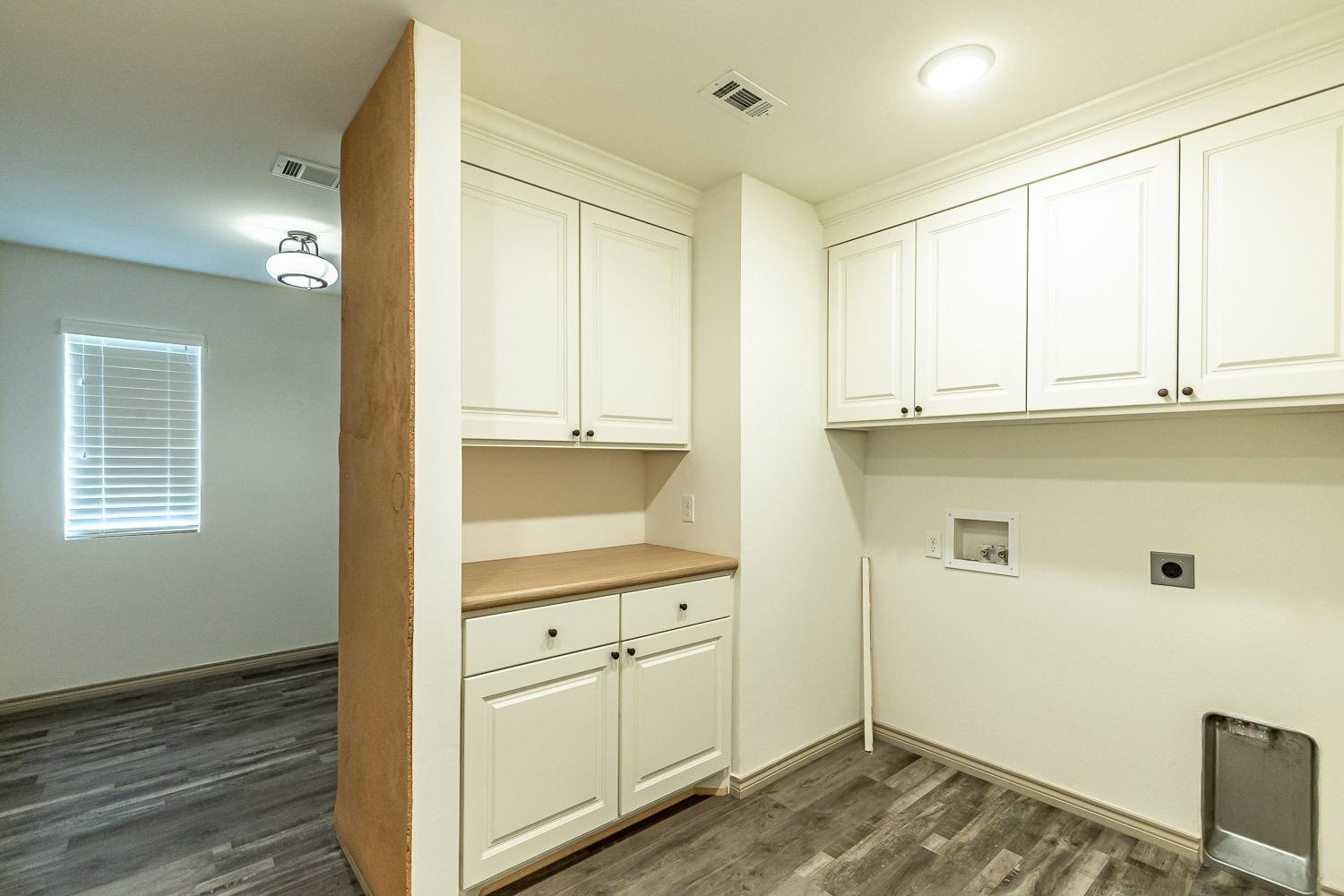 3633 133rd Street Lubbock, TX 79423 - Photo 39 of 46 a view of cabinets and wooden floor