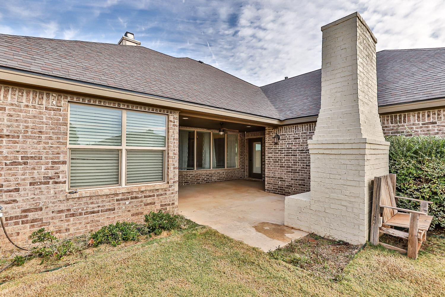 3633 133rd Street Lubbock, TX 79423 - Photo 43 of 46 a front view of a house with garden