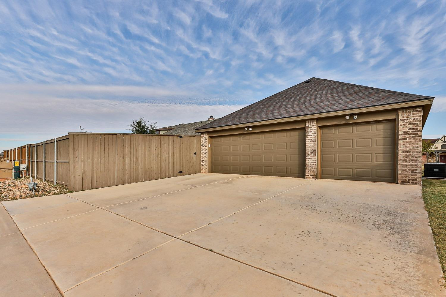 3633 133rd Street Lubbock, TX 79423 - Photo 46 of 46 a house view with a wooden fence
